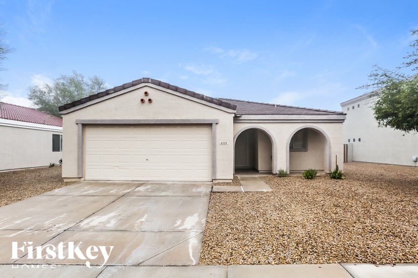 A house with a garage is for sale by FirstKey Homes.