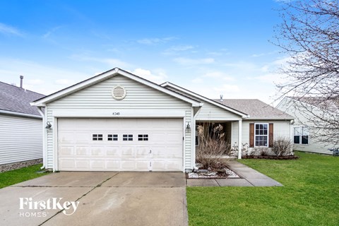 A two-car garage is attached to a house.