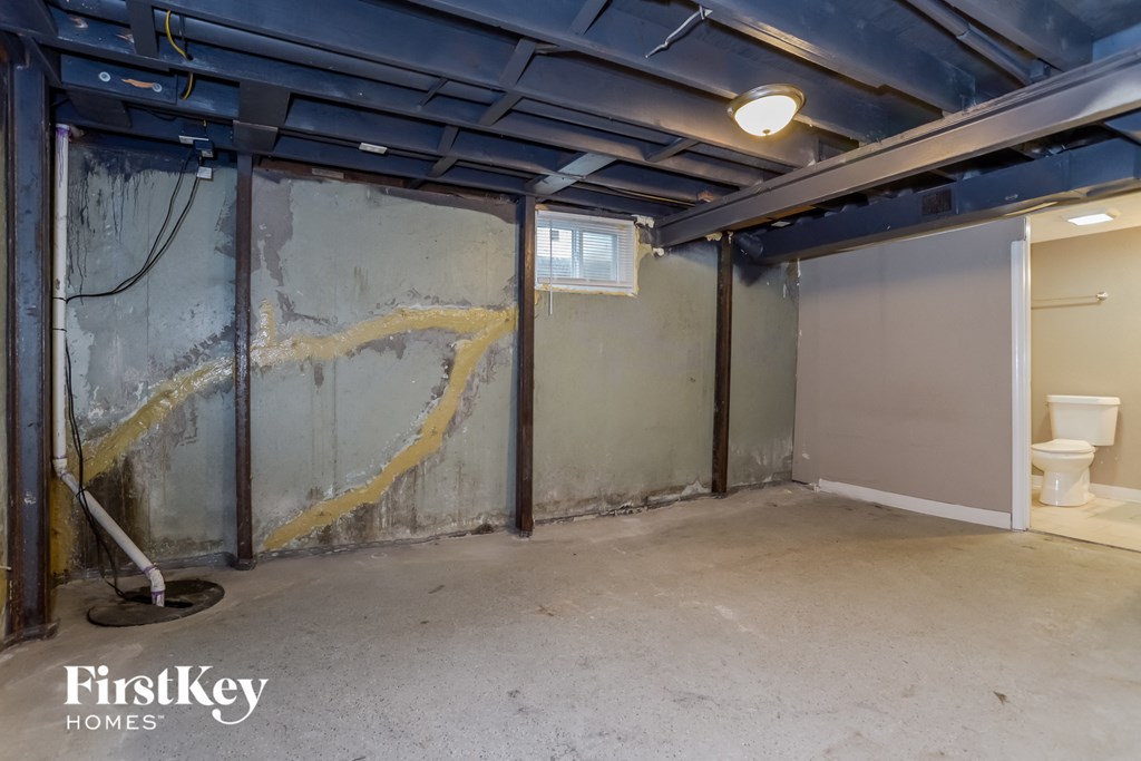 the basement of a house that is being remodeled with the walls and ceiling removed