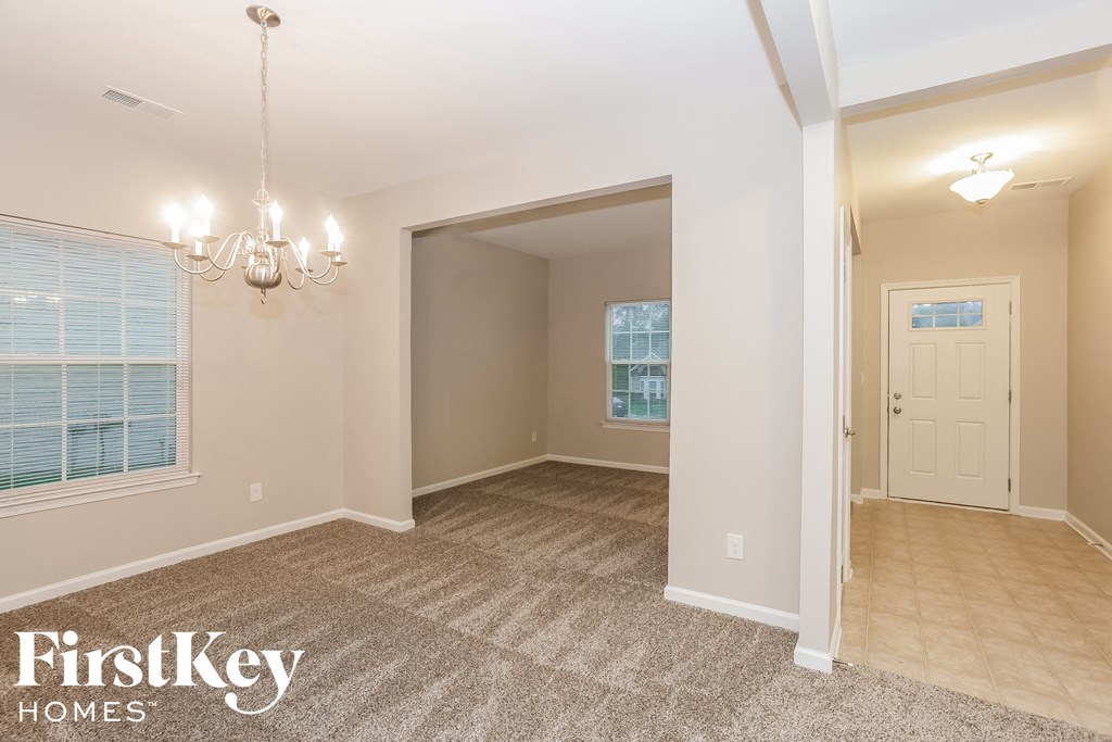 the spacious living room and dining room are open to the kitchen