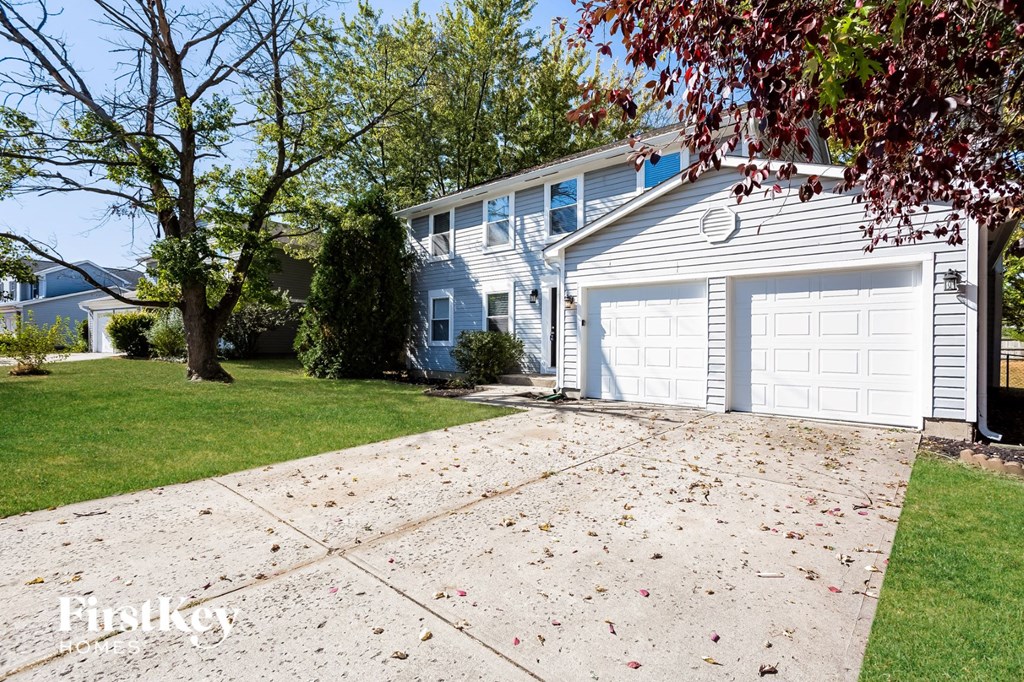 a white house with a white garage door