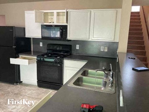 a kitchen with a stove and a sink