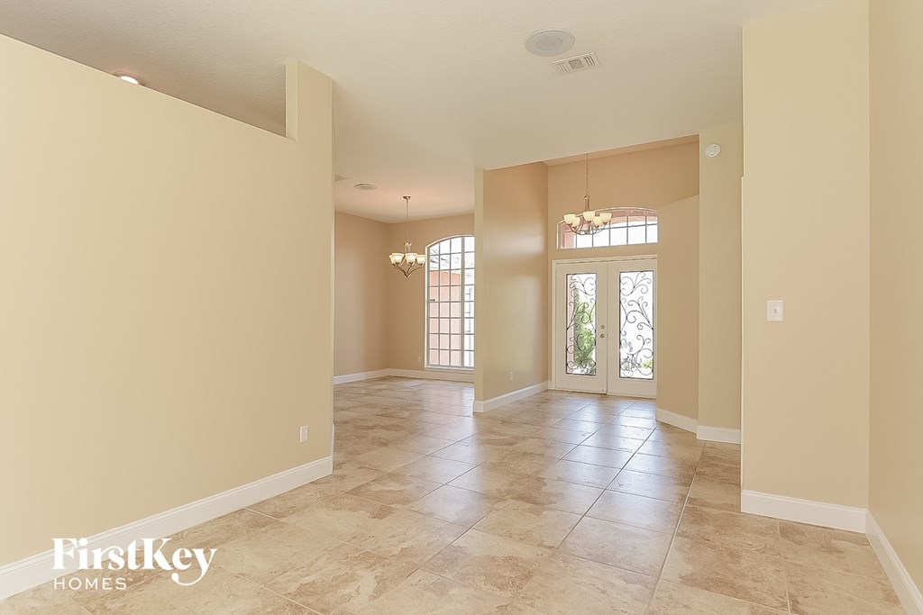 the spacious living room and formal dining room are open to the kitchen and family room