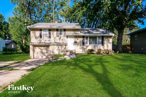 A house with a lawn in front of it.
