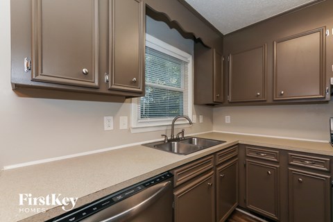 a kitchen with a sink and a window
