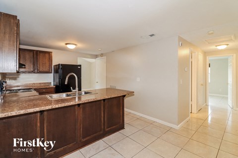 a kitchen with a counter top and a sink