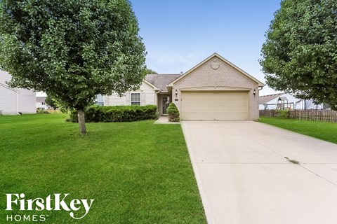 A house with a garage is for sale by FirstKey Homes.