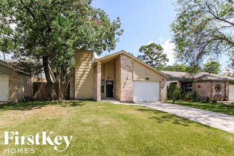 a house with a garage and a lawn