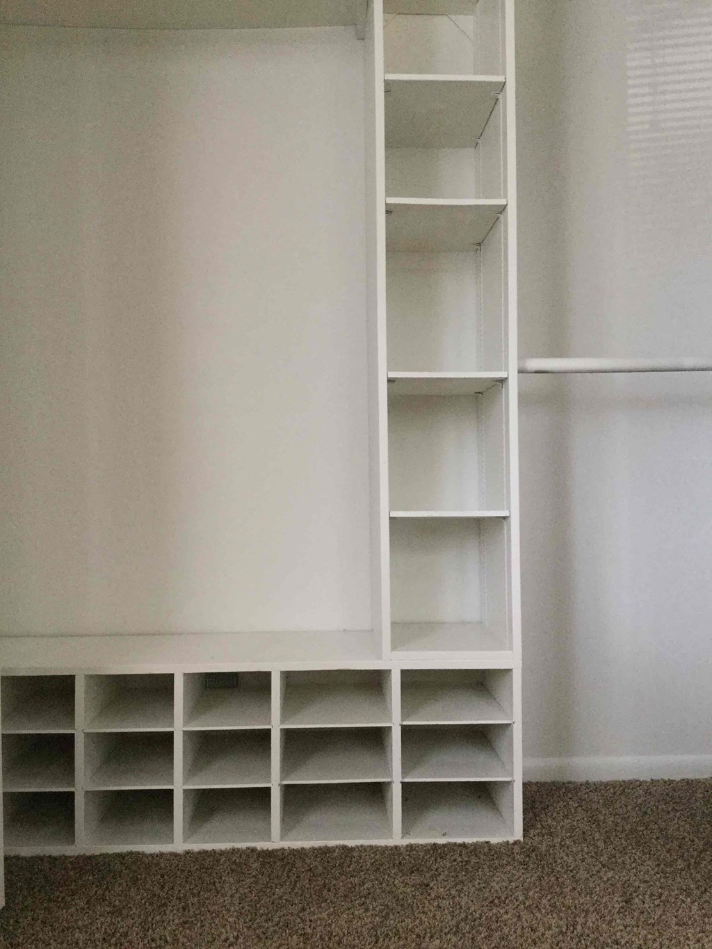 A white shelving unit with multiple shelves.