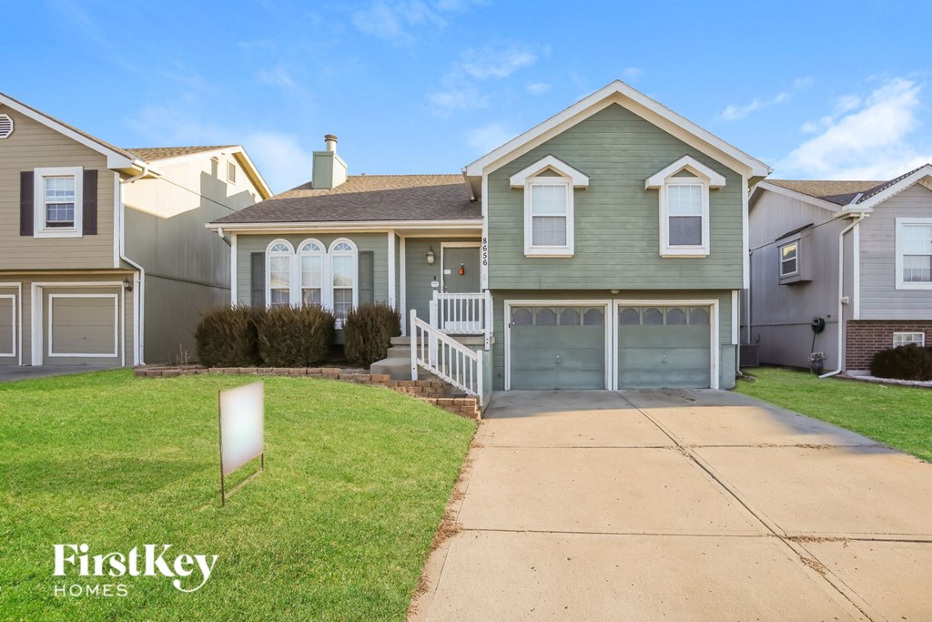A house with a sign that says FirstKey Homes in front of it.