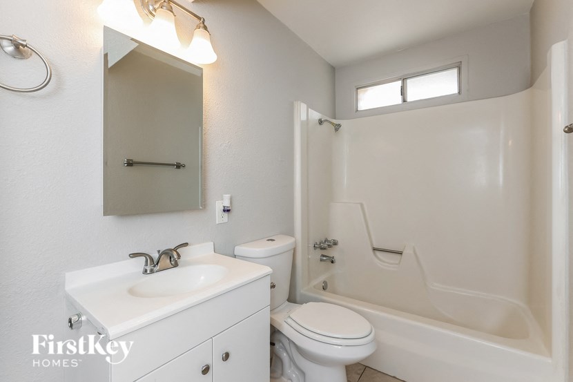 a bathroom with a sink toilet and a shower
