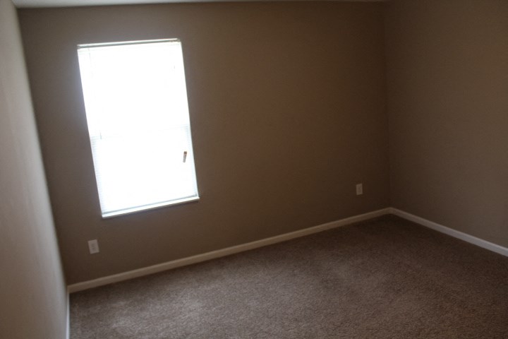 an empty room with a window in it