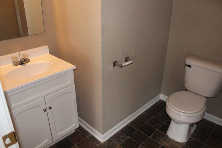 a bathroom with a toilet and a sink