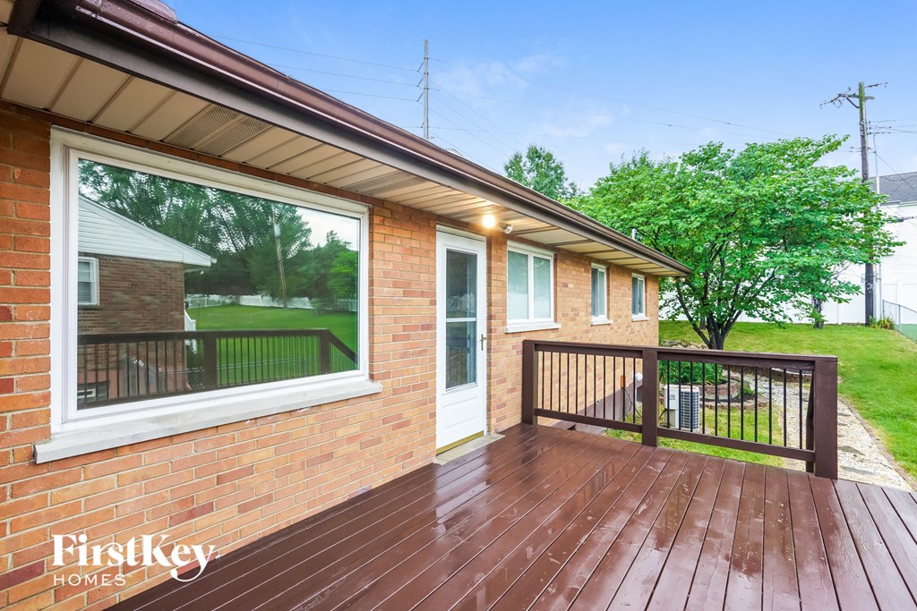 A wooden deck with a FirstKey Homes logo.