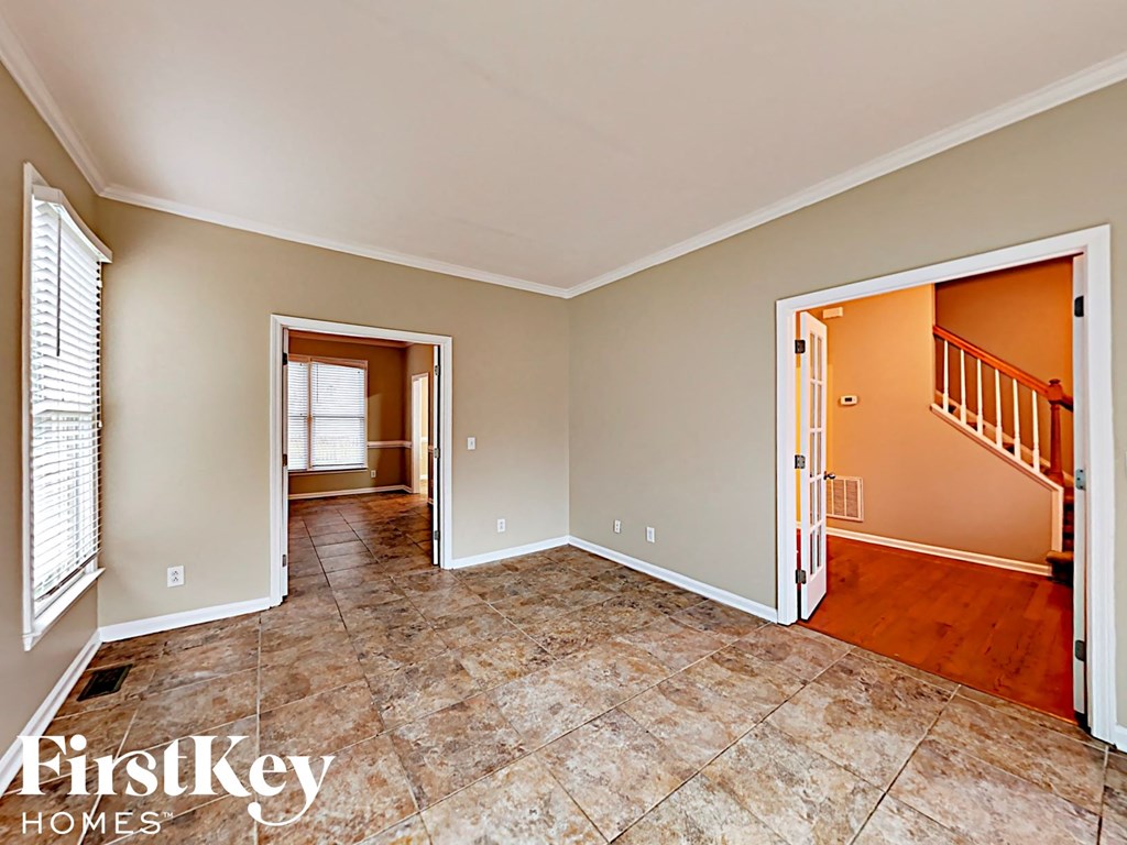 the living room and dining room are open to the hallway and kitchen