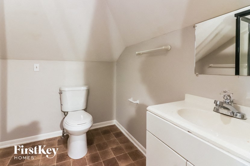 a bathroom with a toilet and a sink