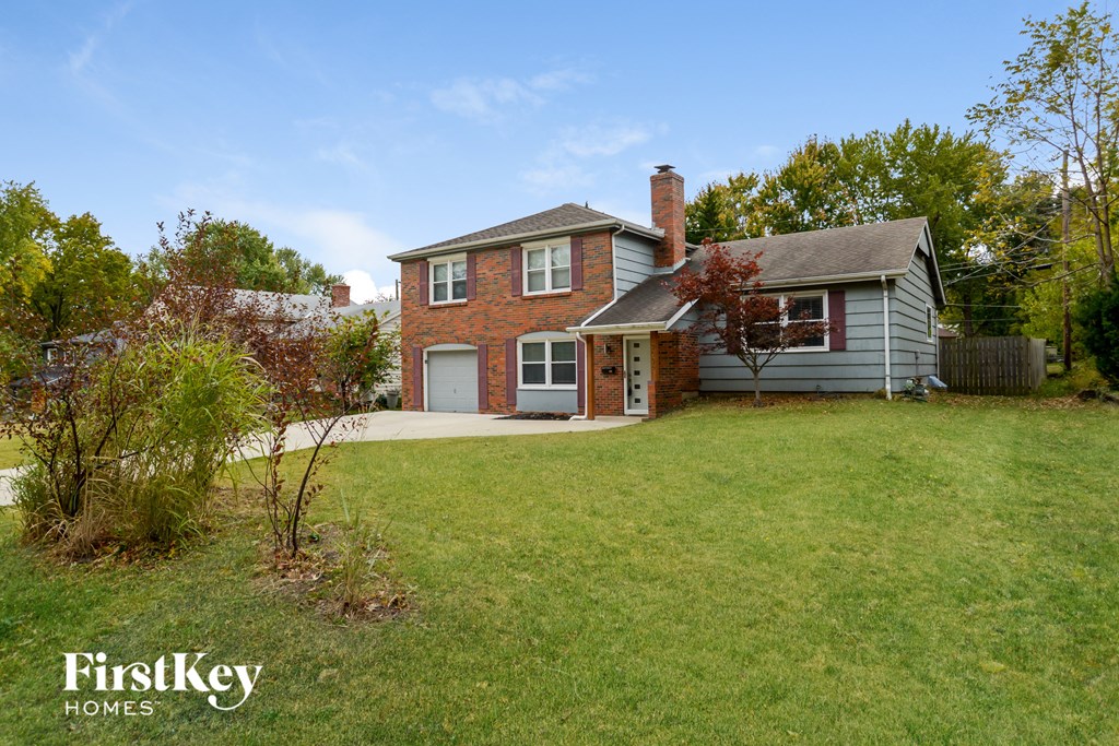 a house with a lawn in front of it