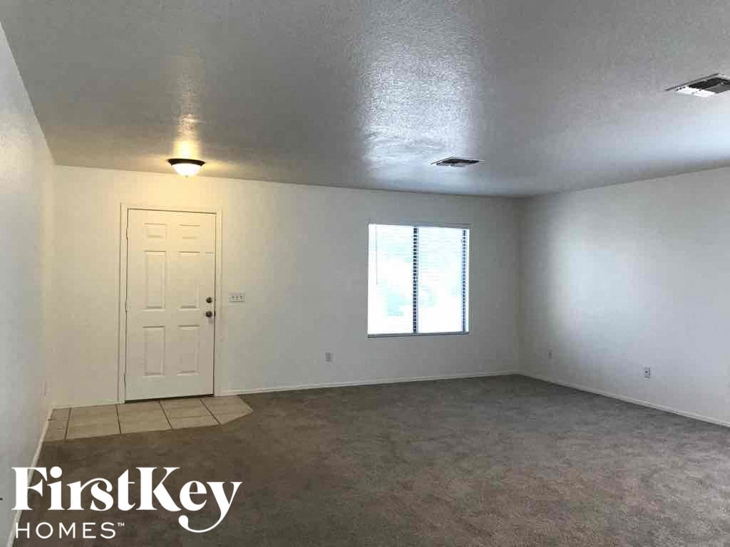 A room with a door and a window, branded with FirstKey Homes.