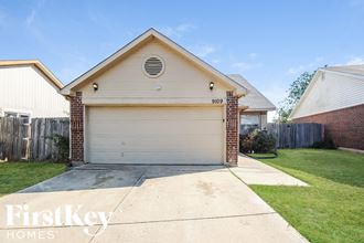 a white garage door in front of a house