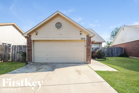 a white garage door in front of a house