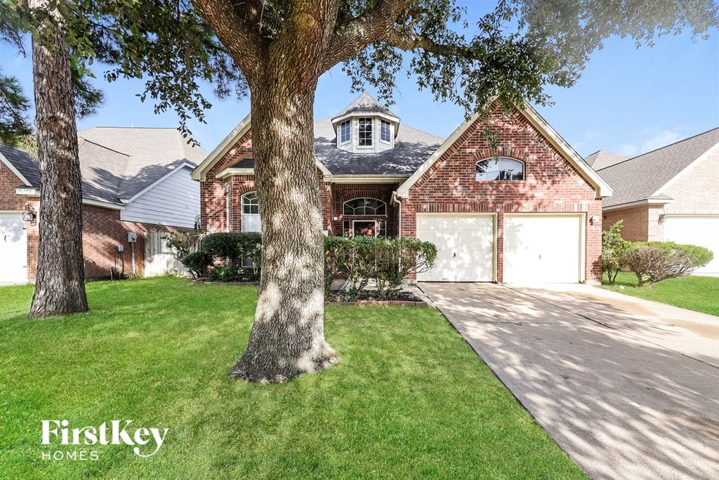 A house with a tree in front of it.
