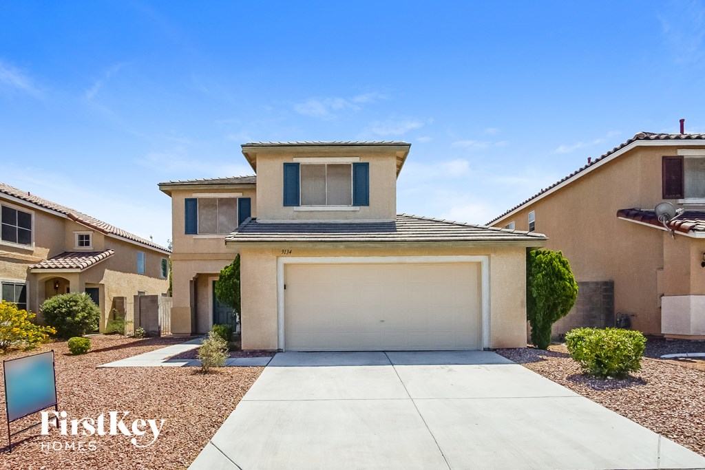 A house with a garage is for sale by FirstKey Homes.