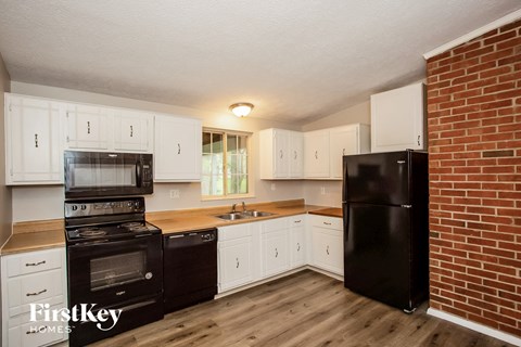 the preserve at ballantyne commons apartment kitchen with black appliances