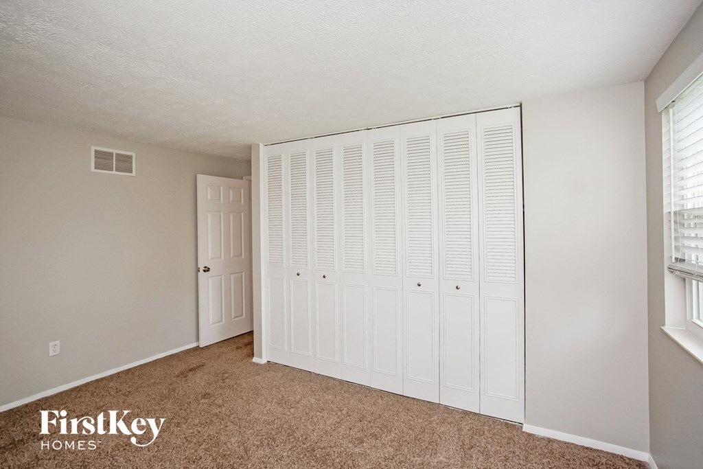 the spacious closet in the master bedroom of this home for sale