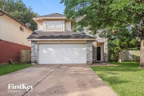 a white garage door in front of a house