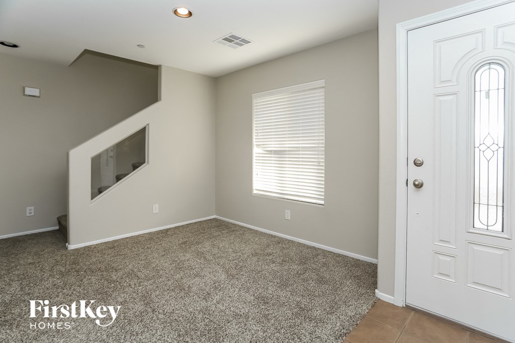 a empty room with a door and a window