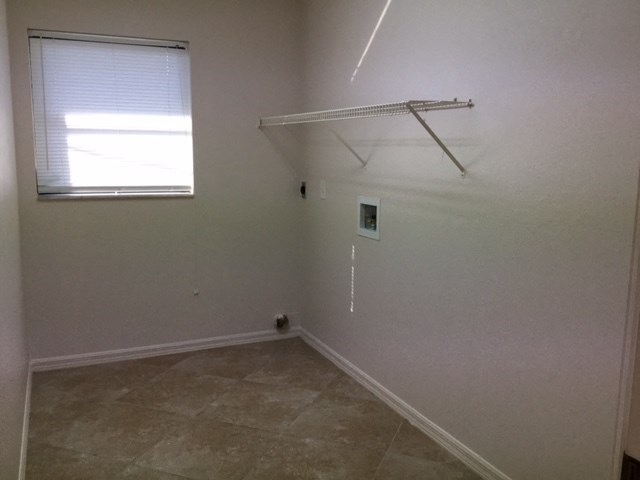 a empty room with a closet and a window