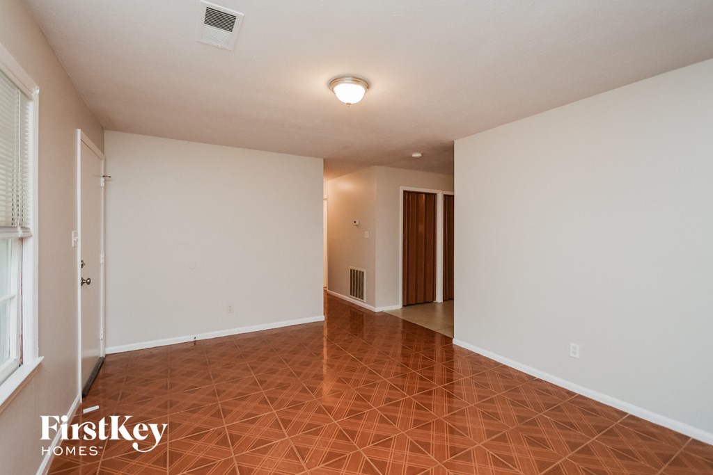 A room with a tiled floor and white walls.