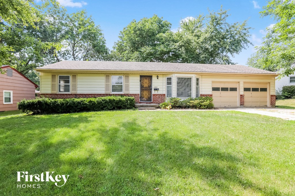 A house with a garage is for sale by FirstKey Homes.