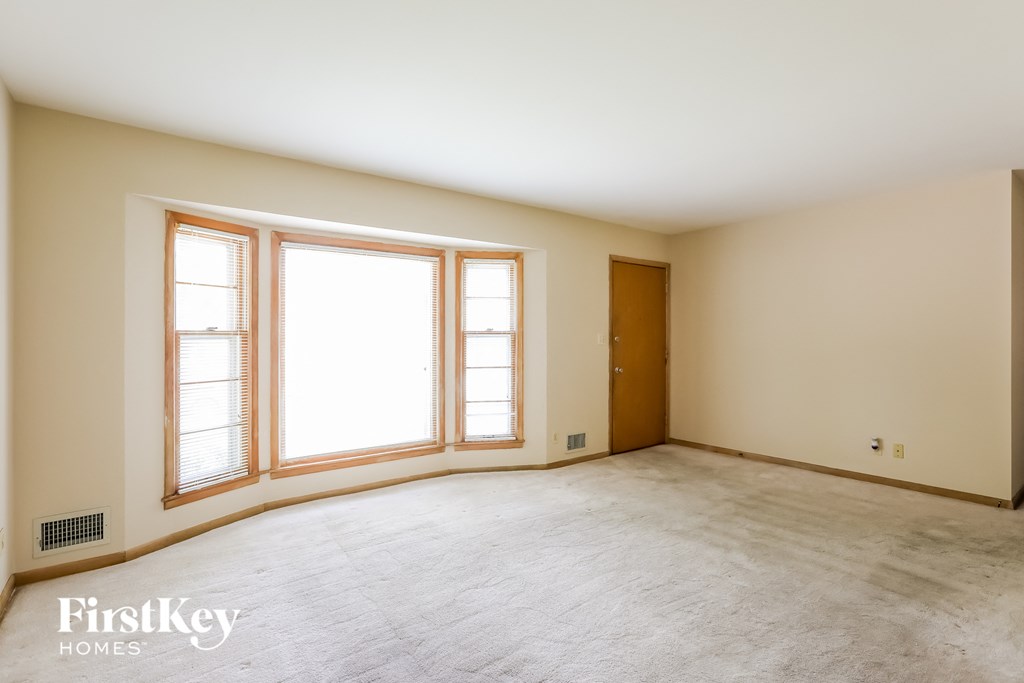 A room with a window and a door.