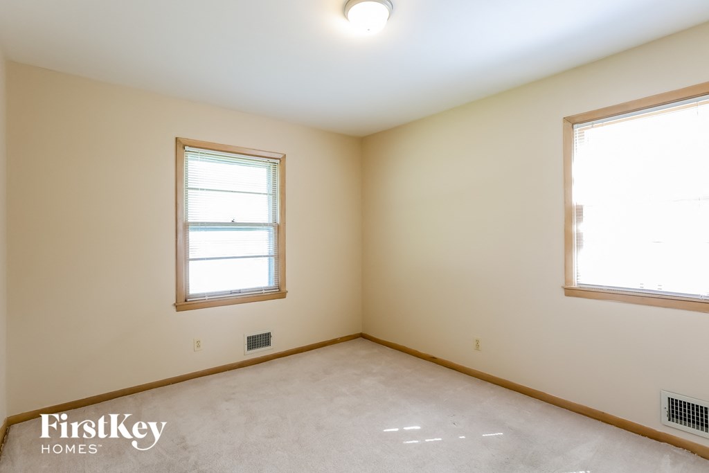 A room with a window and a FirstKey Homes logo.