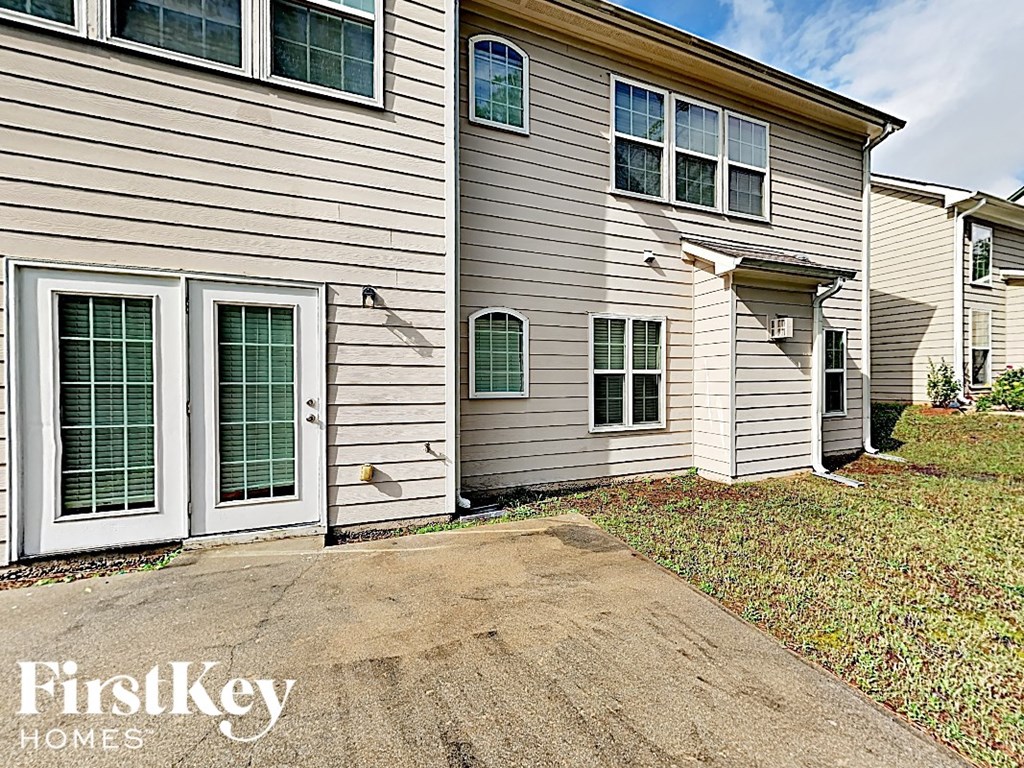 a white house with white siding and white doors