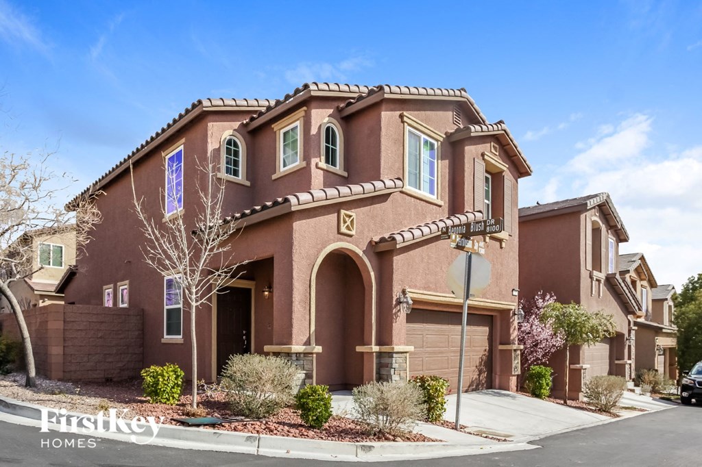 A large house with a sign that says "First Key Homes".