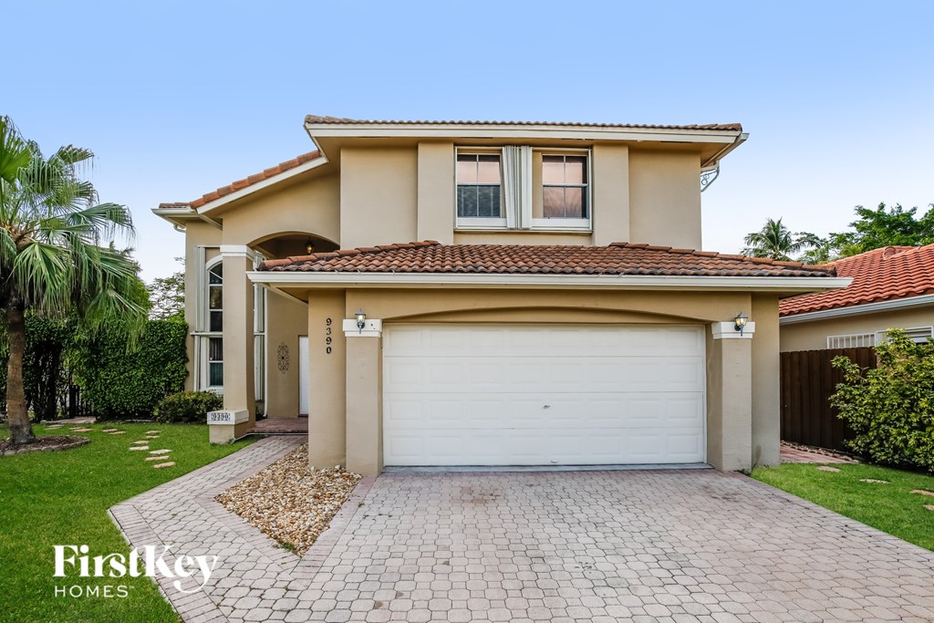 A house with a garage is for sale.
