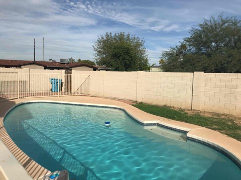 A small pool with a blue ball in the middle.