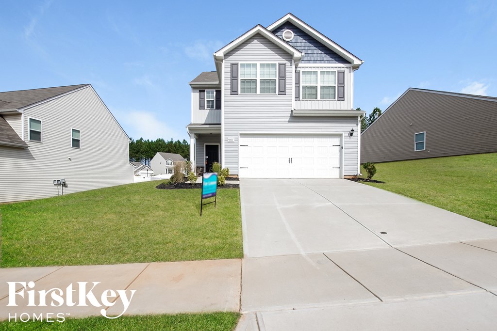 A house with a garage is for sale by FirstKey Homes.