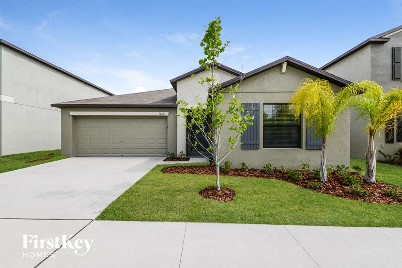 a house with a palm tree in front of it