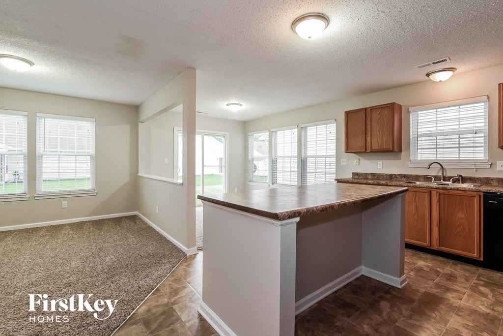 a kitchen with a counter top and a sink
