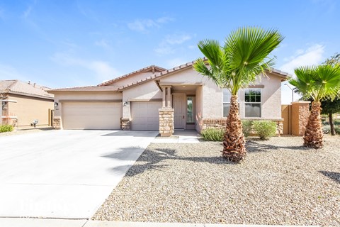 a house with palm trees in front of it