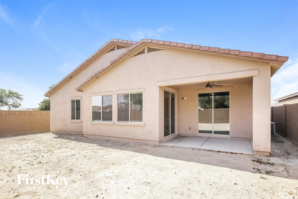 a home with a front door and a dirt driveway