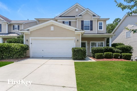 A house with a garage is for sale by FirstKey Homes.