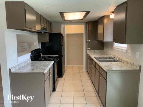 a kitchen with stainless steel appliances and counter tops