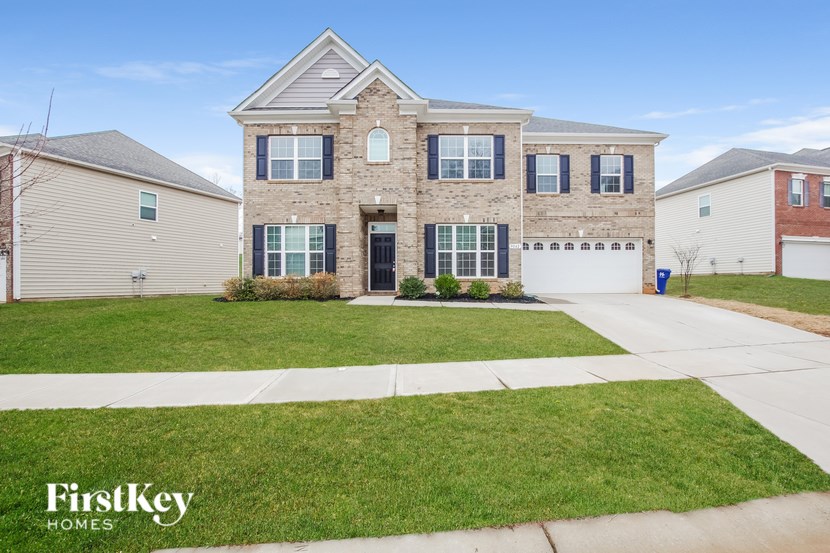 A large house with a garage is for sale.