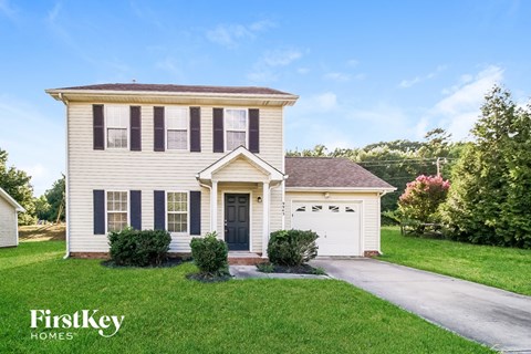 A two-story house with a garage is for sale by FirstKey Homes.