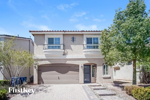 a house with a driveway and a garage door