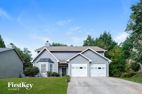 A house with a garage is for sale by FirstKey Homes.